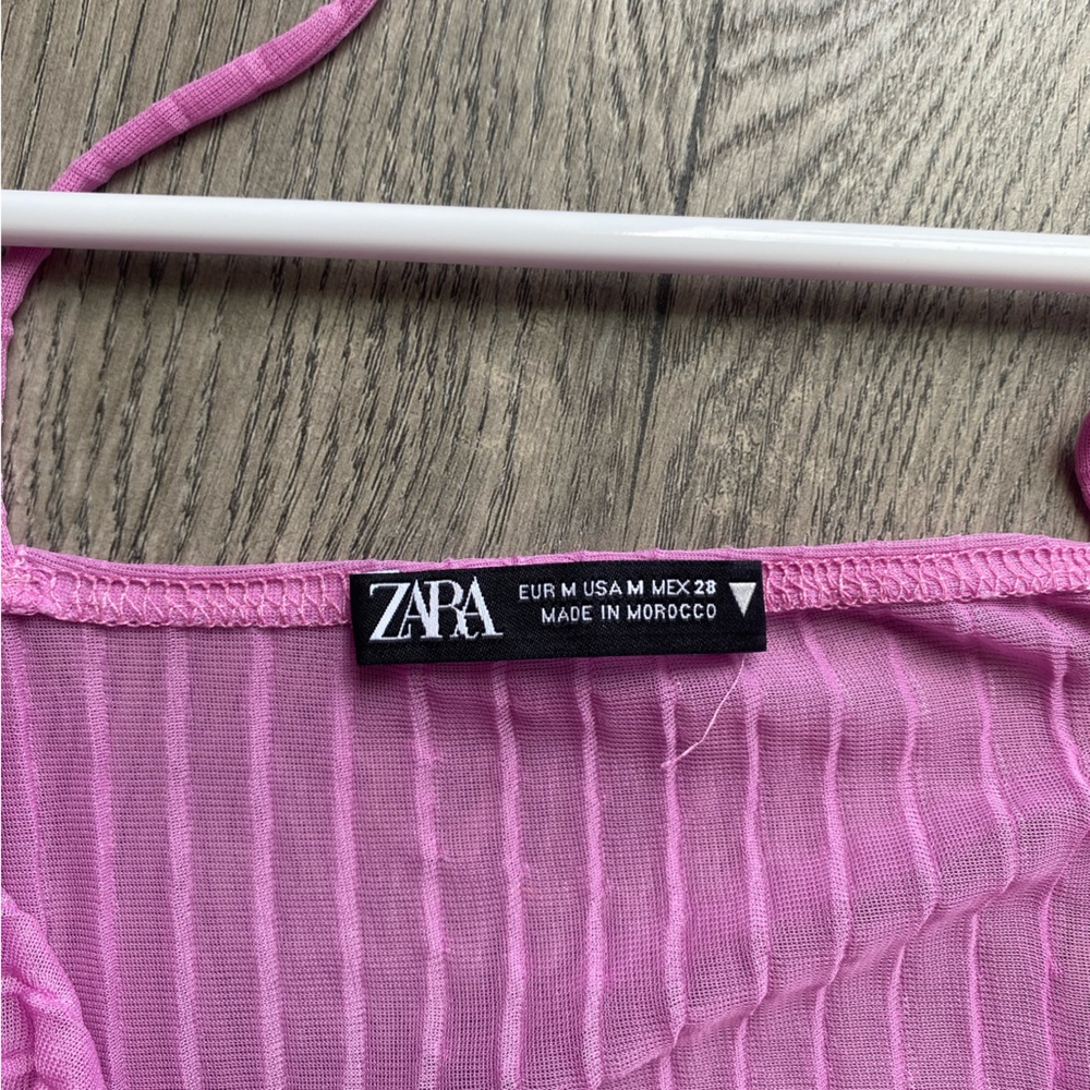 Purple sheer long sleeve crop top with ruffles and cut outs on shoulder